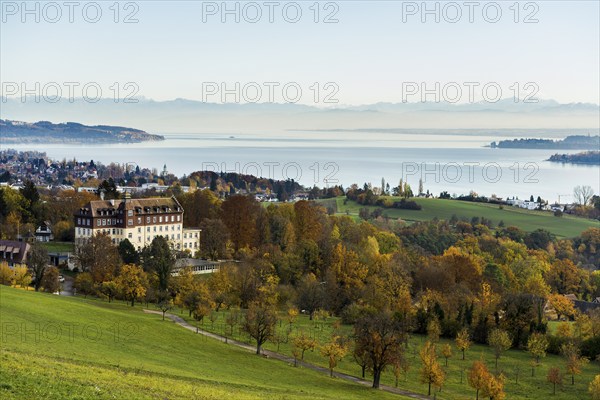 View over Lake Constance in autumn, Spetzgart Castle in front, Alpine chain behind, near