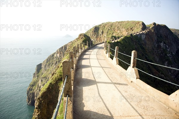 La Coupee narrow track between Sark and Little Sark, Island of Sark, Channel Islands, Great Britain