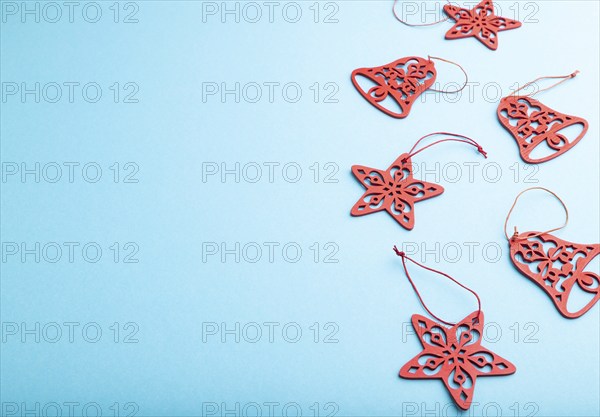 Christmas or New Year composition. Decorations on a blue pastel background. Side view, copy space