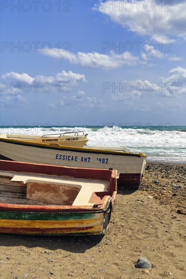 Fishing boats on a pebble beach, surf, Cabo de Gata Natural Park, Las Negras, Almeria, Andalusia,