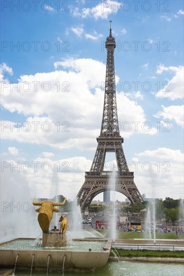 Eiffel Tower, Tour Eiffel, behind a fountain with sculpture, statue Taureau et Daim (Bull and