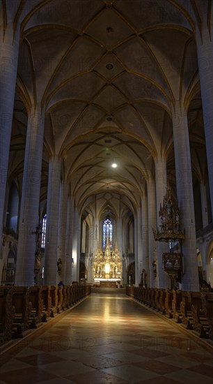 Rays of sunlight flood the quiet interior of St Martin's Basilica, Amberg, Upper Palatinate,