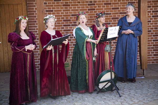 Sweet Harmonie female singing group in Tudor costume performing at Layer Marney Tower, Essex,