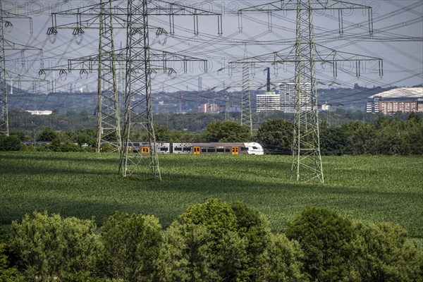 Railway line between Essen and Bochum near Wattenscheid, RRX Rhine-Ruhr Express, regional train,