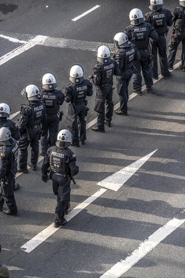 Police officers, police task force, on duty at the demonstration against the AFD party conference