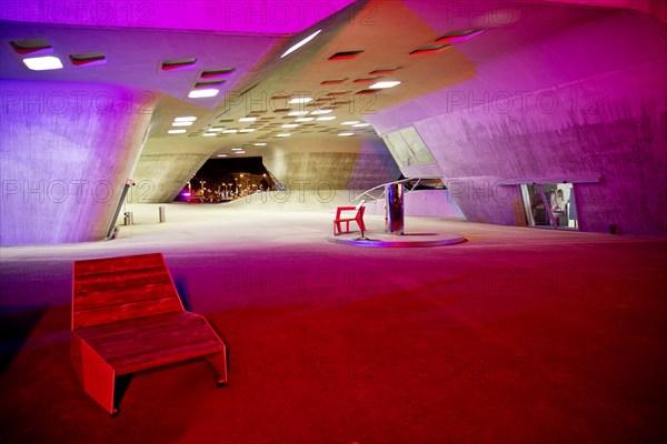 The colourfully illuminated phæno building, an experimental landscape and a science centre in the