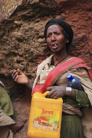 Pilgrim at the rock-hewn churches in Lalibela, container for holy water, Ethiopia, Africa