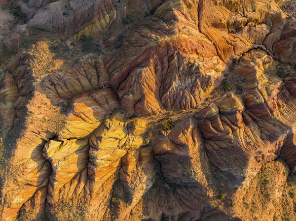 Aerial view, eroded mountain landscape, sandstone cliffs, canyon with red and orange rock