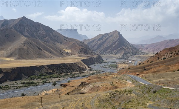 Pamir Highway, mountain road through eroded mountain landscape, Kyrgyzstan, Asia