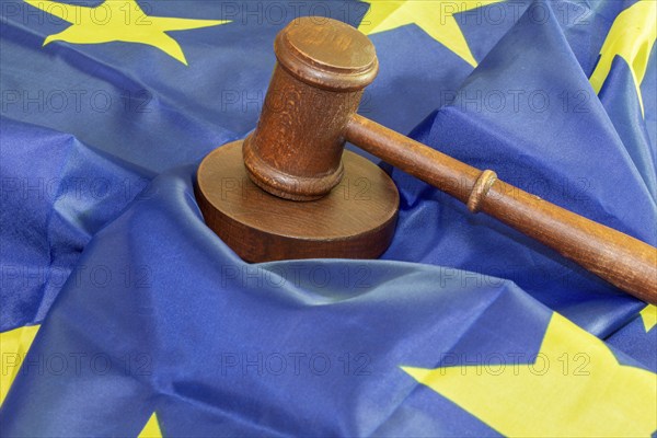 Symbolic image: Judge's gavel on a flag of the European Union