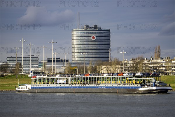 The Rhine at Neuss Vodafone building, cargo ship, vehicle transporter Fuerte, of BLG Autotransport