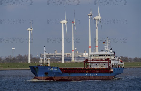Cargo ship in the Ems estuary, wind turbines, Lower Saxony, Germany, Europe