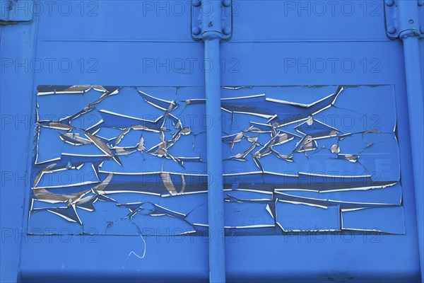 Close-up of cracked and peeling blue paint on metal shipping container, Quebec, Canada, North