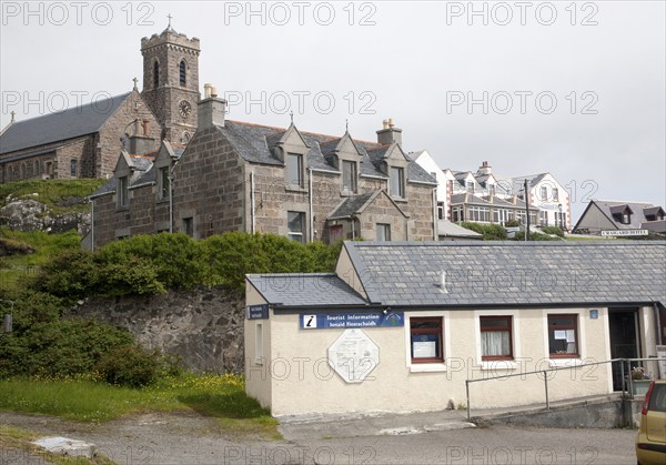 Tourist Information office, houses, hotel and church in Castlebay, Barra, Outer Hebrides, Scotland,
