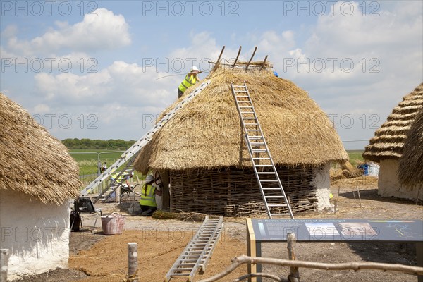 Buildings of replica Neolithic huts at the Stonehenge site, Wiltshire, England, UK