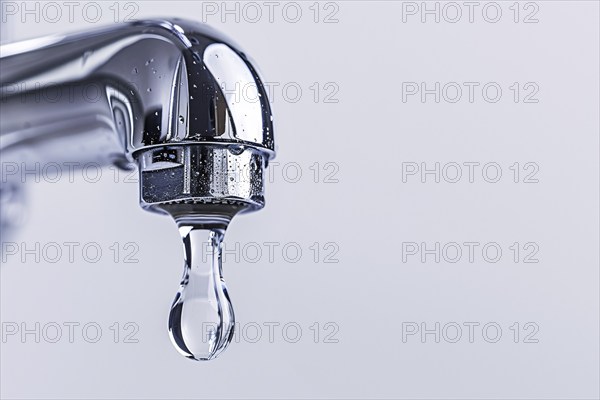 Single drop of water coming out of water tap. KI generiert, generiert, AI generated