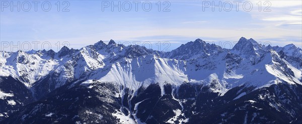 Alpine panorama with snow-covered mountain peaks in winter. Taken in the ski resort of Serfaus Fiss