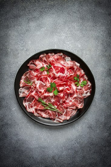 Sliced cured ham, prosciutto, italian dish, delicacy, parma ham, top view, no people