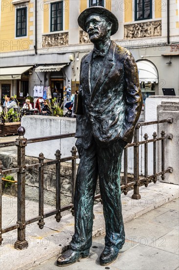 Statue of James Joyce by Nino Spagnoli, commercial and residential buildings of old families on the