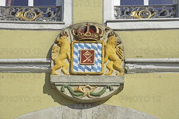 Coat of arms with lion figures, crown and post horn, market square, Feuchtwangen, Middle Franconia,