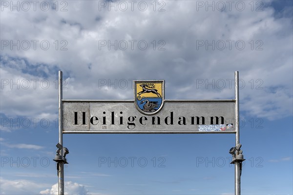 Welcome sign Heiligendamm with coat of arms of Bad Doberan and Heiligendamm at the pier,