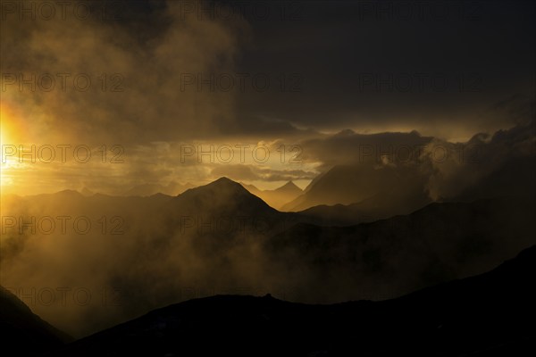 Montafon mountains with dramatic cloudy sky at sunset, Tschagguns, Rätikon, Montafon, Vorarlberg,