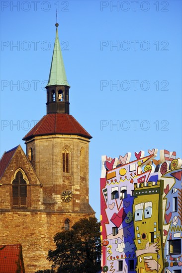 Magnikirche next to the Happy Rizzi House by the artist James Rizzi, architectural contrast,