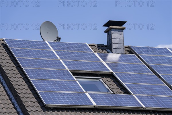 Solar system on the pitched roof of a residential building, photovoltaics for power generation, for