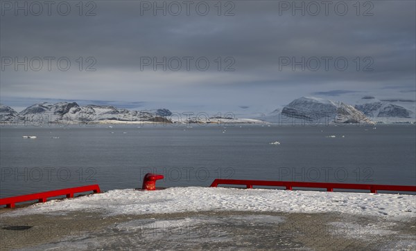 Red bollard and harbour boundary, harbour area, Ny-Ålesund, Kongsfjord, Spitsbergen Island,