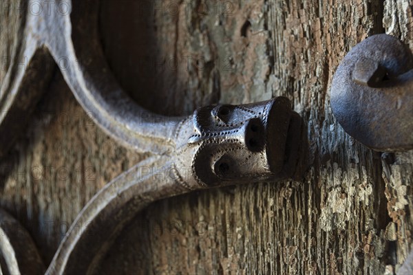 Orcival. Intricate Roman wrought iron hinge displayed at the Basilica Notre-Dame d'Orcival, Puy de