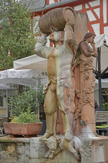 Drunken fountain with robber baron Friedrich von Hattstein knight as a sculpture with fountain,