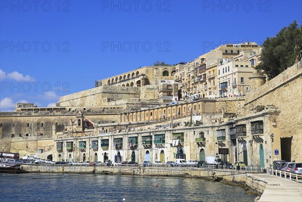 Historic waterfront buildings on Grand Harbour waterside, Valletta, Malta, Europe