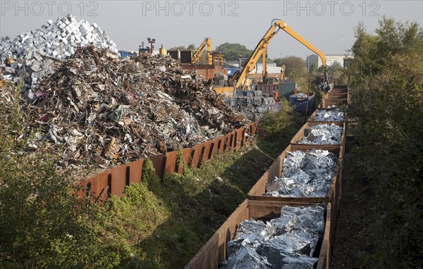 Scrap metal recycling loading train wagons with processed metals, EMR company, Swindon, England, UK
