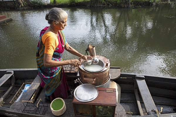 Tealady, 83 years old, bottles Indian tea, Backwaters, Kumarakom, Kerala, India, Asia
