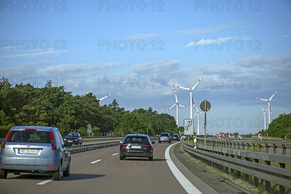 Wind turbines on the A 9 motorway, cloudy sky, Brandenburg, Germany, Europe