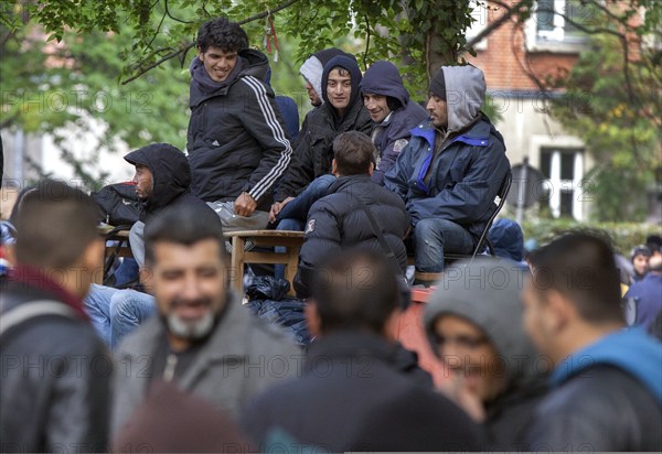 Refugees from Syria waiting to be registered at the Central Reception Centre for Asylum Seekers at