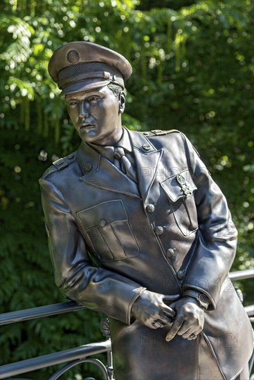 Bronze statue, monument to rock singer Elvis Presley, King of Rock 'n' Roll in uniform of the 3rd