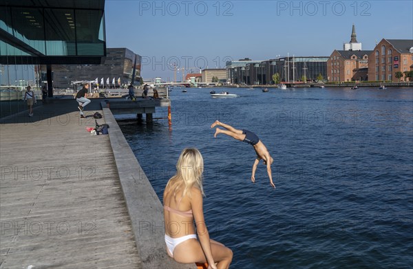 Summer, swimming in the harbour of Copenhagen, there are official bathing places, harbour baths and