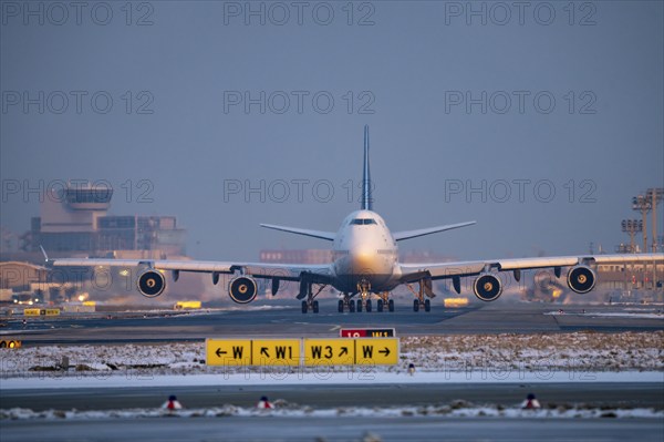Lufthansa Boeing 747-8, on the taxiway to Runway West, Frankfurt FRA Airport, Fraport, in winter,