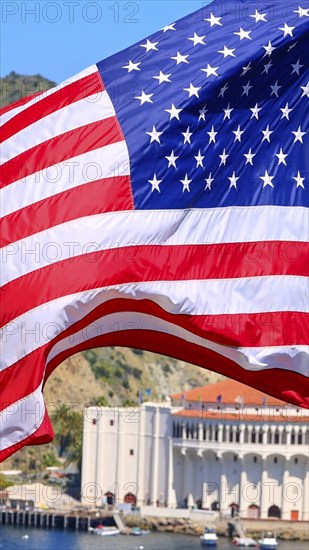 American star spangled flag waving in California. A large American flag is flying high above
