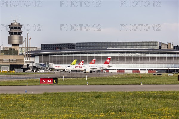 Swiss airline aircraft at Zurich Airport. Terminal and tower. Zurich, Switzerland, Europe