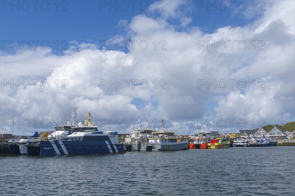 Supply ships for the wind power off-shore plants, catamarans, offshore island of Helgoland, blue