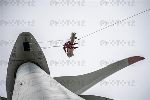 Height rescuers from the Oberhausen professional fire brigade practise abseiling from a wind