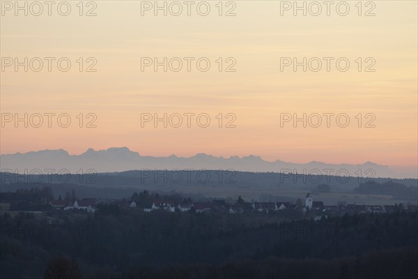 Alpine panorama near Magolsheim. Säntis, Swiss Alps at cloudless sunset with a view of Mehrstetten.