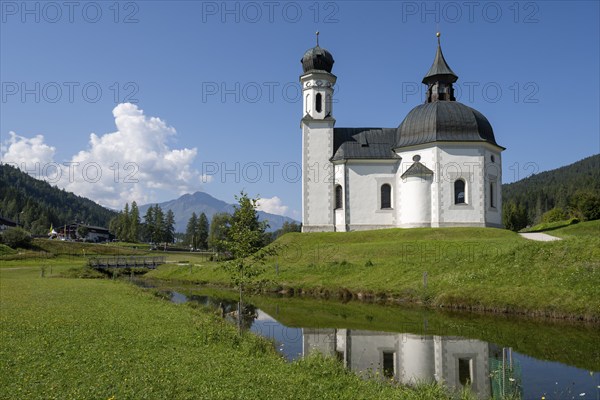 Seekirchl mi reflection, Heiligkreuzkirche, view from the parish hill, Seefeld, Tyrol, Austria,