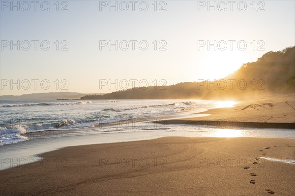 Sandy beach beach and sea at sunset, Playa Cocalito, coastal landscape, Pacific coast, Nicoya