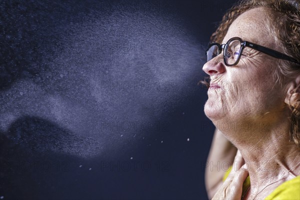 A woman sneezes. Berlin, 09.08.2024