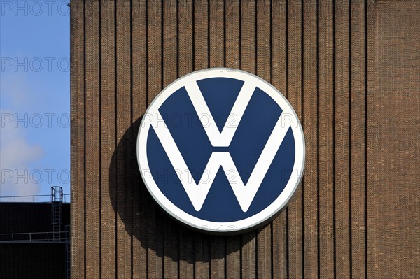 Large VW logo on the old cogeneration plant, Volkswagenwerk Wolfsburg, main plant of Volkswagen AG,