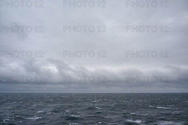 A stormy and turbulent sea under a cloudy grey sky, North Sea, Norway, Europe