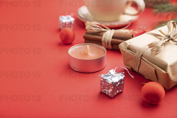 Christmas or New Year composition. Decorations, box, cinnamon, fir and spruce branches, cup of